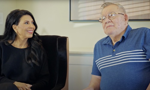 two people sitting in chairs